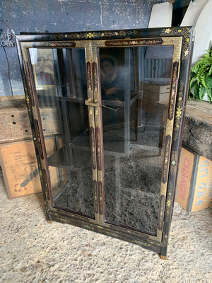 A black lacquer Chinoiserie display cabinet