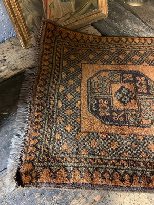 A Persian gold ground rectangular rug - 132 x 66cm