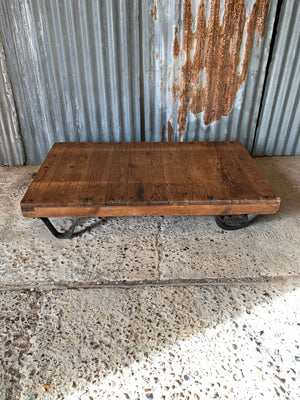 A vintage industrial trolley coffee table