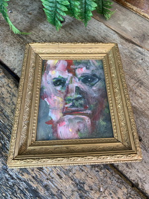 A framed expressionist portrait
