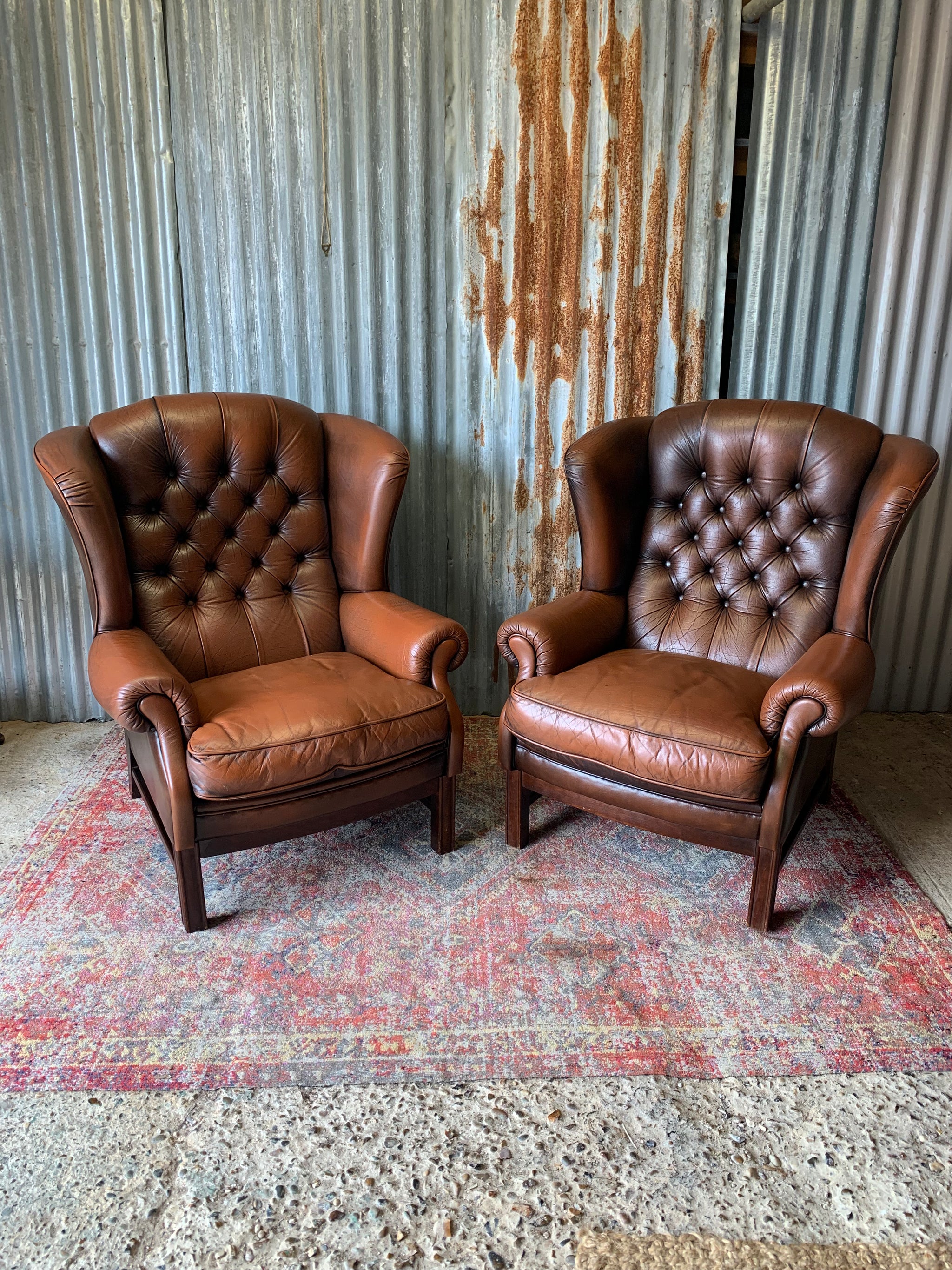 A brown wingback Chesterfield armchair with button back Belle