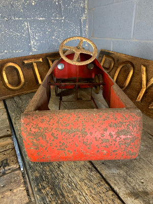 A Tri-ang Thunderbolt child's pedal car