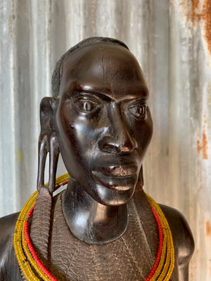 A large carved wooden Maasai figure
