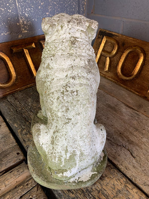 A cast stone bulldog statue