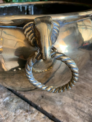 An Anglo-Indian brass jardiniere with elephant head handles
