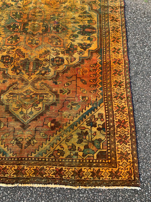 A large gold Persian rectangular rug - yellow/mustard tones