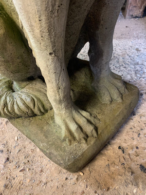 A cast stone garden statue of a mythical hound - 97cm