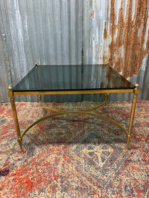 A brass and green glass Hollywood Regency coffee table
