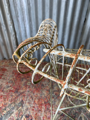 A cast iron wirework garden set