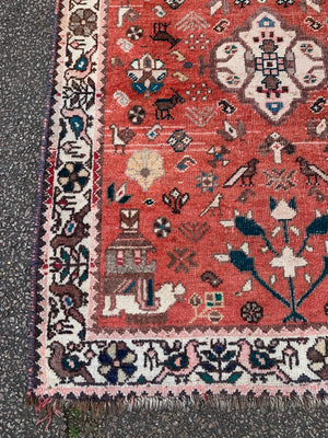 A Persian Qashqai rug featuring birds and beast - 150 x 108cm