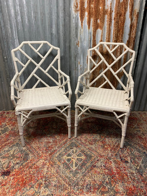 A pair of white faux bamboo Chinese Chippendale chairs
