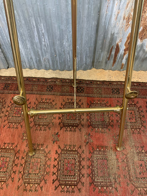 A brass full size floor standing display easel