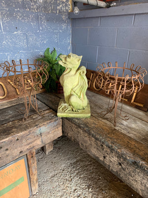 A pair of rusty wrought iron plant stands