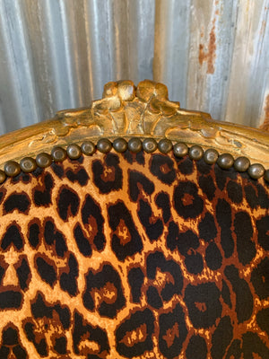 A leopard print giltwood open armchair