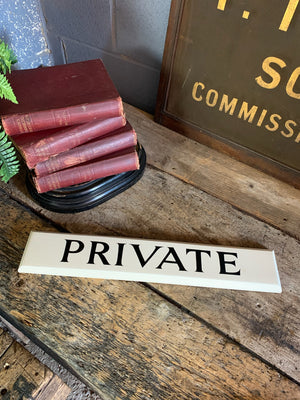 A hand painted wooden 'Private' sign