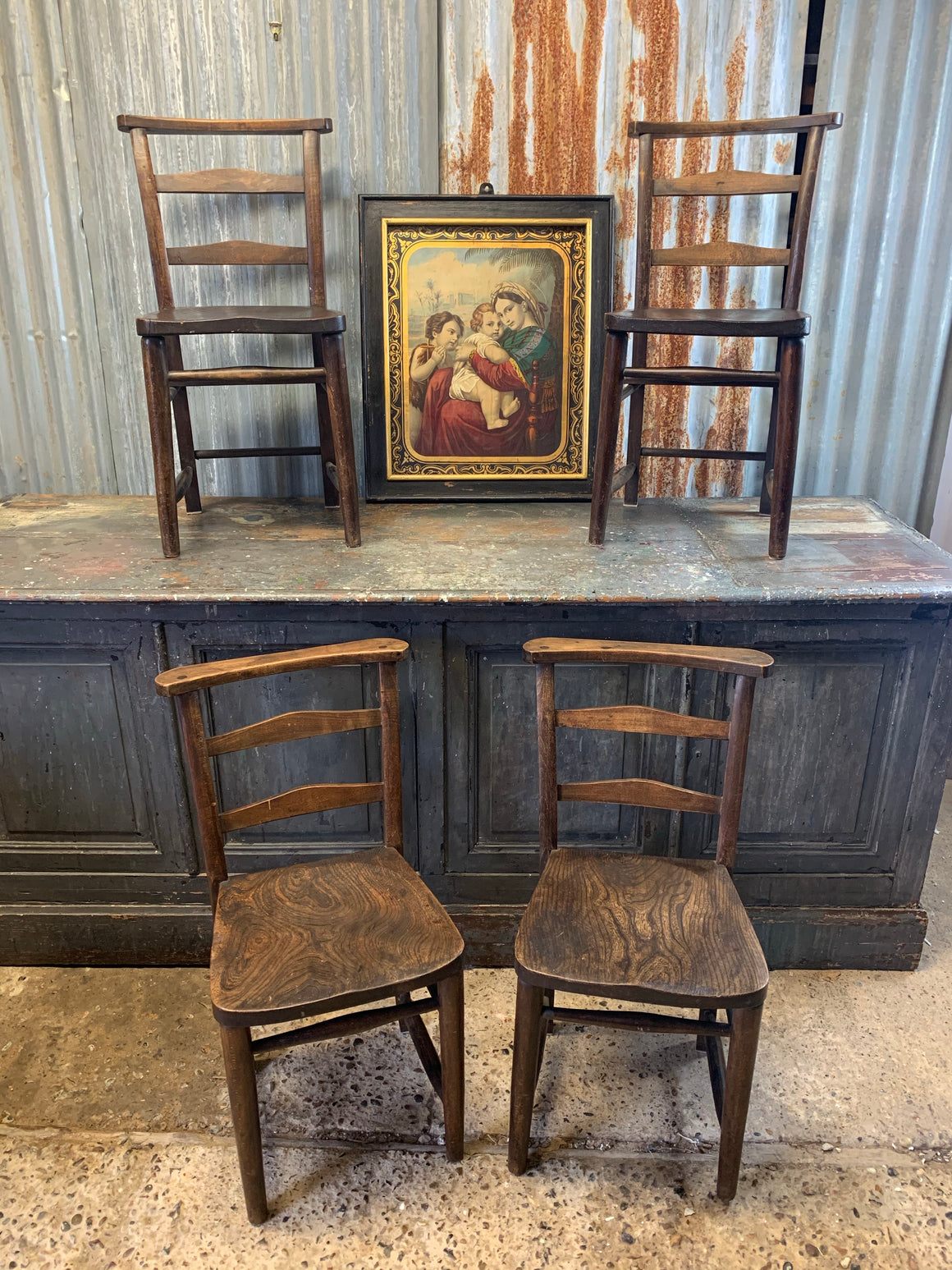 A set of four oak 19th Century chapel chairs