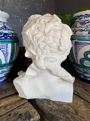 An oversized neo-classical white plaster bust