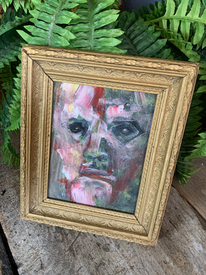 A framed expressionist portrait