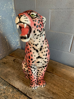 A large pink ceramic leopard statue made in Italy