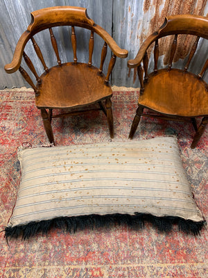 A large rectangular Persian carpet floor cushion