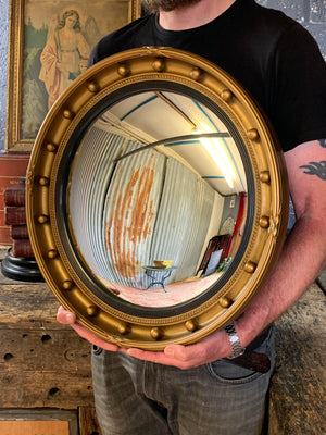 A very large gilt convex ball mirror