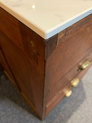 A bank of 4 drawers by Martin & Co.