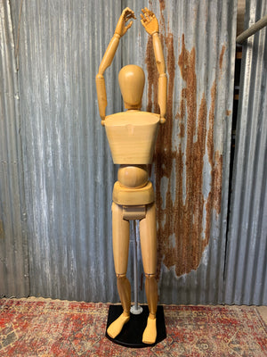 An articulated full form artist’s lay figure
