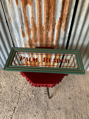 A large Palm Reader fairground mirror