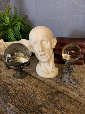 A fortune teller's crystal ball on a bronze stand