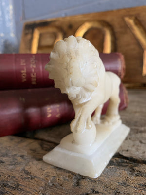 An opposing pair of Grand Tour alabaster Medici lions