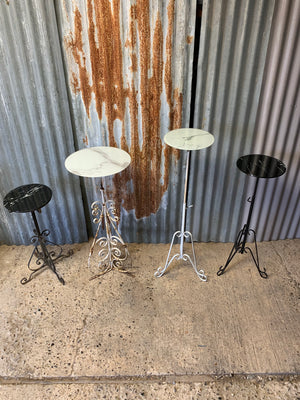 A black metal garden wine table or stand