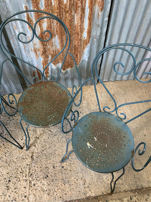 A set of four French blue wire work garden chairs