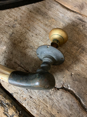 A very large hippo tooth door handle with bronze mount