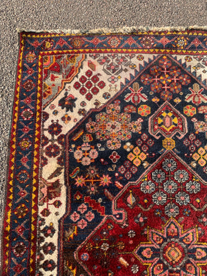 A Persian floral patterned rectangular rug