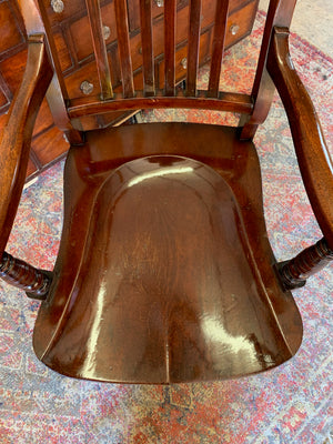 A 19th Century mahogany open arm library chair