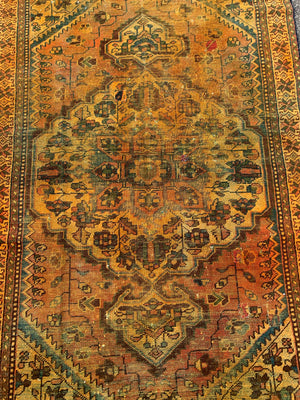A large gold Persian rectangular rug - yellow/mustard tones