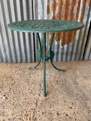 A green garden table and chairs set