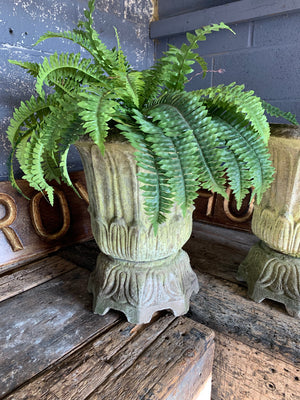 A pair of large lotus pattern cast stone urns