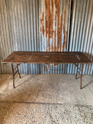 A wooden plank top folding trestle table - Table 3