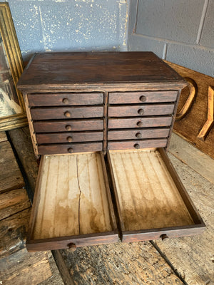 A bank of wooden ‘Lion and Wreath Trademark’ haberdashery draws