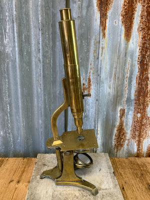A 19th Century solid brass monocular microscope