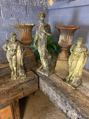 A large pair of cast iron campana urns on pedestals