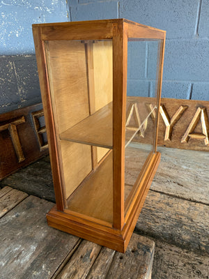A glass table top shop display cabinet