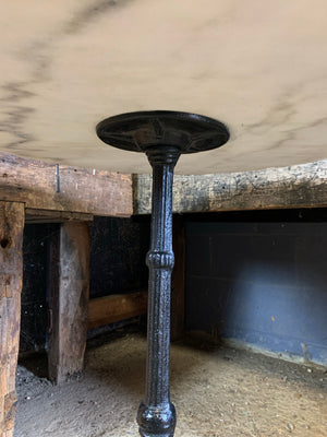 A black cast iron bistro table with marble top 3/3