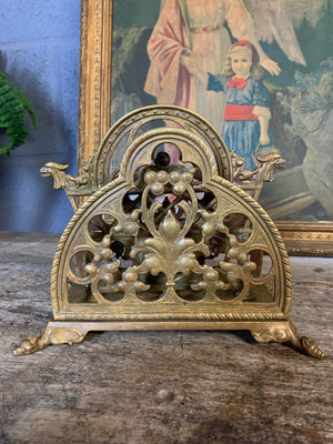 A gilt bronze Gothic letter rack with bat and griffin motifs