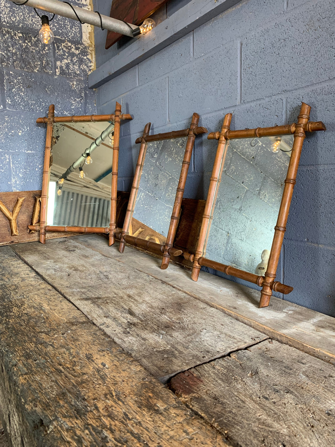 A trio of French faux bamboo wall mirrors
