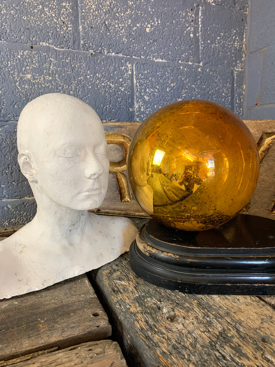 A very large golden mercury glass witches ball