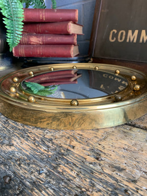 A large Regency style brass convex ball mirror