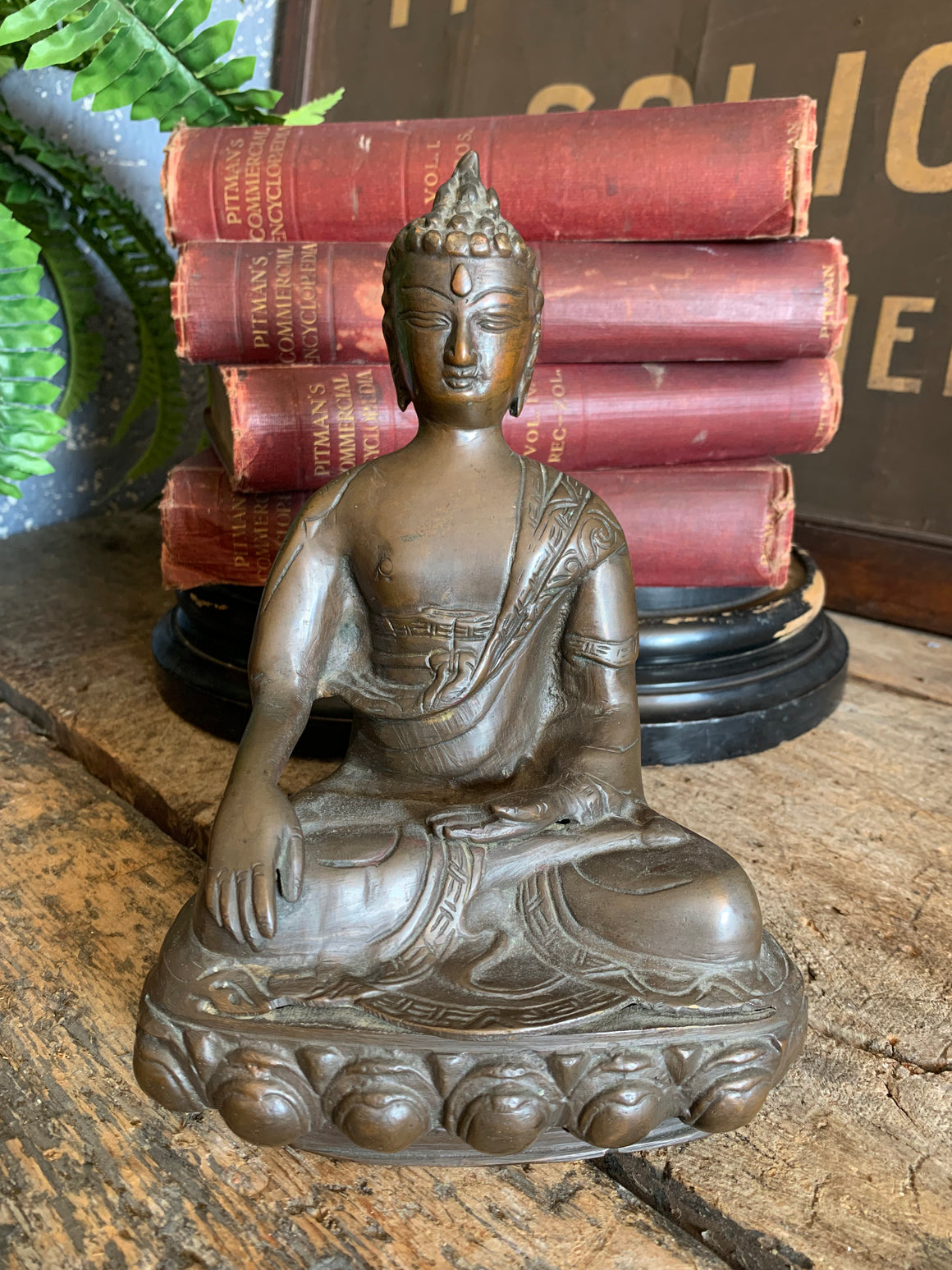 A bronze seated Buddha figure