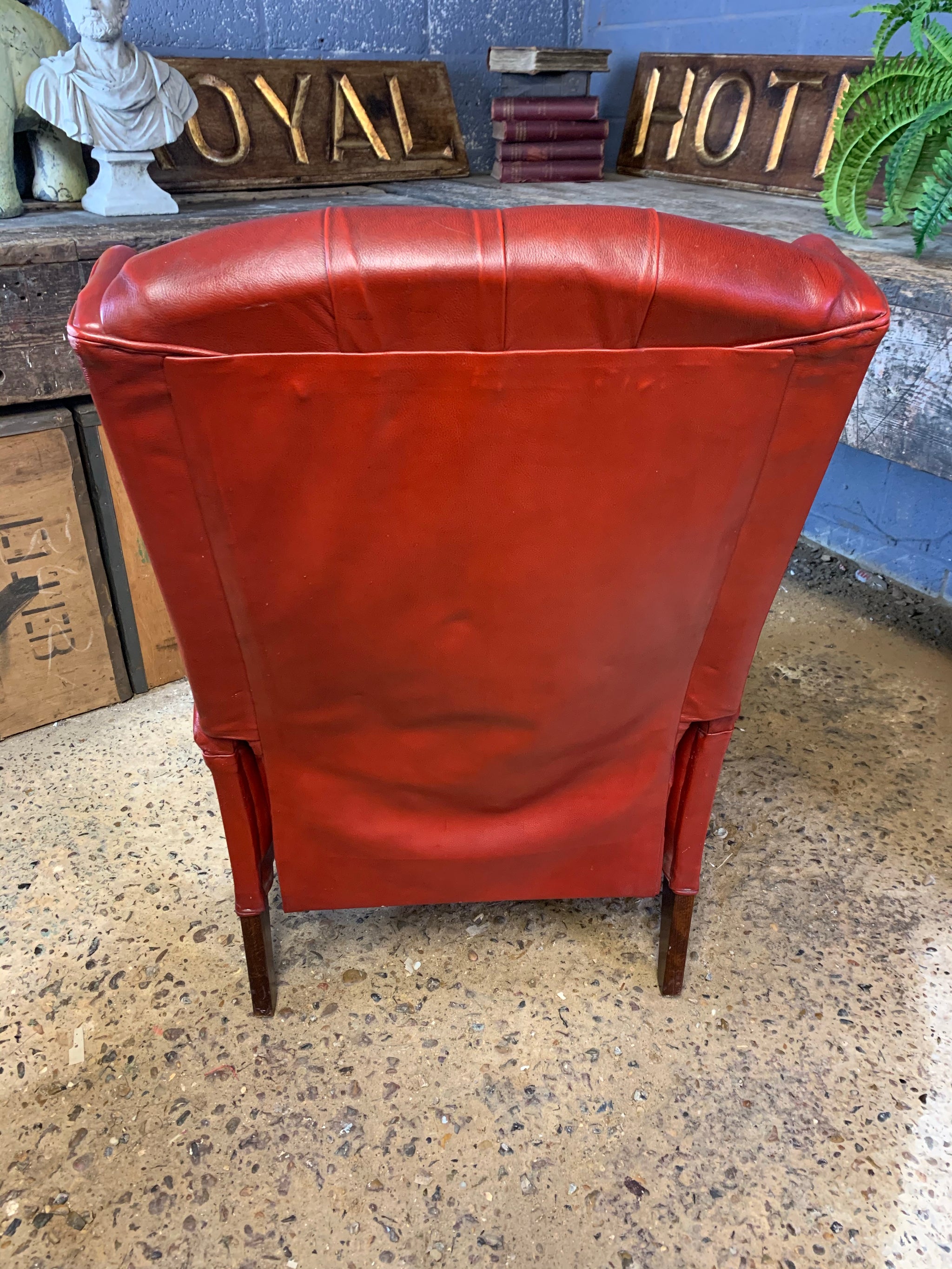 A red wingback Chesterfield recliner armchair Belle and Beast